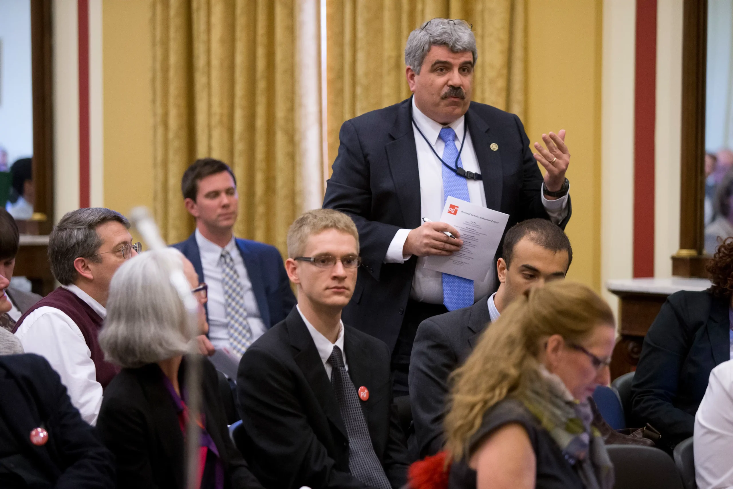 Person stands up in the audience to ask a question.